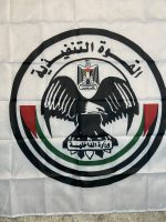 Introducing the Hamas Executive Force Flag, measuring 150 cm in height and 90 cm in width. This flag features the distinct design associated with the Hamas Executive Force, showcasing the iconic eagle emblem and the Palestinian national colors of black, white, green, and red. The text “السلطة التنفيذية” (Executive Authority) and “وزارة الداخلية” (Ministry of Interior) add to its authenticity. Crafted from high-quality polyester, this flag is perfect for collectors, historians, and reenactors who appreciate the detailed symbolism and historical significance of Middle Eastern flags. Whether displayed in a collection or used for educational purposes, this flag is a noteworthy addition for those interested in the history and politics of the region. Please note: This flag is not authentic and is intended for educational and collector purposes only.