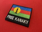 Kanak, Kanaky, Free Kanaky, New Caledonia, independence movement, decolonization, indigenous rights, flèche faîtière, Kanak flag, Kanak struggle, political patch, freedom patch, sovereignty, self-determination, cultural symbolism, independence flag, freedom flag, solidarity, resistance, embroidered patch, Velcro patch, iron-on patch, collectible patch, historical patch, protest patch, activist patch, Kanak pride, Melanesia, French colonialism, independence supporter, custom patch, patch for jackets, embroidered emblem, flag patch, Kanaky emblem, political symbols, indigenous symbols, freedom fighters, revolution patches, native pride.