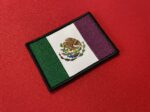 Feminist Mexican flag, purple Mexican flag, bandera feminista, bandera de la Revolución Mexicana, feminist symbolism, Mexican revolution flag, lucha feminista, águila y serpiente emblem, purple revolution flag, women’s rights in Mexico, social justice flag, Elsa Oviedo, activism patch, feminist art, bandera morada, customizable feminist patch, feminist heritage patch, feminist revolution, feminist pride, purple stripe flag, feminist movement patch, igualdad de género, Mexican emblem patch, purple Mexican revolution, lucha por la igualdad, feminismo en México, feminist collectible.