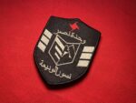 Wihdat Nasr Nusur al-Zawba’a, Eagles of the Whirlwind, SSNP, Syrian Social Nationalist Party, Nasr Unit, Whirlwind Unit, embroidered patch, tactical patch, military patch, unit insignia, historical reproduction, collector’s patch, re-enactment, militaria, Arab nationalist, Levant, Syria, Lebanon, black shield, red emblem, Arabic script, faction insignia, special forces patch, political movement, resistance, paramilitary, custom patch, rare patch, heritage, emblem, insignia, replica patch, custom embroidery, historical memorabilia, vintage patch, military history, jacket patch, bag patch, tactical gear, uniform patch, Middle Eastern history, Arab world, nationalist movement, custom collectible