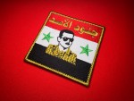 Junoud al-Assad patch, جنود الأسد, Assad patch, Bashar al-Assad patch, Syria patch, Syrian flag patch, pro-Assad patch, Syrian military patch, Syrian Arab Army patch, Syrian civil war patch, Assad loyalist patch, National Defence Forces patch, Shabiha patch, Syrian militia patch, Syrian propaganda patch, Middle East patch, Arab army patch, Syria army patch, embroidered Assad patch, Syrian morale patch, Syria war patch, pro-regime patch, Syria collectible patch, Assad insignia, Syrian uniform patch, Syrian memorabilia, Syria conflict patch, Middle Eastern military patch, Syria paramilitary patch, syrian patch for sale, buy Syria patch, Syrian badge, Bashar patch, Syria army badge, Assad flag patch