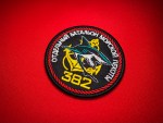 Circular embroidered morale patch with shark and anchor, Cyrillic text “Отдельный батальон морской пехоты,” unit number 382, Russian Naval Infantry design on red fabric background.