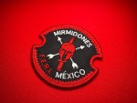 Embroidered Mirmidones F.E.R.I. patch from the Mexican National Guard, featuring a Spartan helmet with crossed weapons and circular red-and-black design.