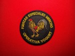 Round black embroidered patch featuring a rooster emblem with Spanish text reading “Fuerzas Especiales Mencho” and “Operativa Yogurt,” measuring 3.5 inches in diameter.