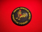 Round black embroidered patch featuring a rooster emblem with Spanish text reading “Fuerzas Especiales Mencho” and “Operativa Yogurt,” measuring 3.5 inches in diameter.