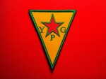 Embroidered YPG triangular patch featuring a yellow field with a red five-pointed star, green border, and YPG lettering, Kurdish militia–style insignia reproduction for collectors and historical display.