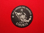 Embroidered circular black patch reading “A la Orden del Mando R” and “F.E.C Chukis,” featuring a stylized map of Mexico with a Chucky-inspired skull motif and two stars, associated with the Los Chukys faction of the Cartel del Noreste.