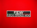 Black embroidered FEW Fuerzas Especiales Wicho patch with white lettering and Mexican tricolor stripe, rectangular 9.5 x 2.5 inch tactical-style insignia on red background.
