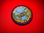 Round 3.75-inch embroidered Ethiopian Air Force emblem patch featuring aviation wings, crossed weapons, Ethiopian star, national tricolor, wreath elements, and Amharic banner on a light blue field.