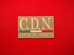Embroidered tan rectangular patch reading “C.D.N.” with a small Mexican tricolor bar and “CARTEL DEL NORESTE,” shown on a red background.