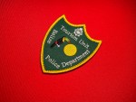 Belize Police Department Tourism Unit patch with toucan and sun on green shield, yellow border, embroidered police insignia 3.8x3 inches