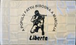 Corsican Ribellu nationalist flag featuring a black rebel figure, “A Populu Fattu Bisogna A Marchja” slogan, “Liberta” text, white field, and left-side pole sleeve.