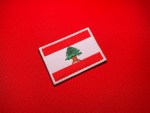 Embroidered State of Free Lebanon historical flag patch featuring a red and white Lebanese flag with a green cedar tree, brown trunk and branches, available with either a white or red satin border.