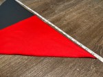 Red and black triangular neckerchief shown with measuring tape demonstrating approximately 29-inch width.