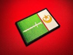 Angled close-up of a Moro Islamic Liberation Front (MILF) reproduction embroidered flag patch, featuring a white sword on green, gold crescent and star on white, red divider, and black satin border.